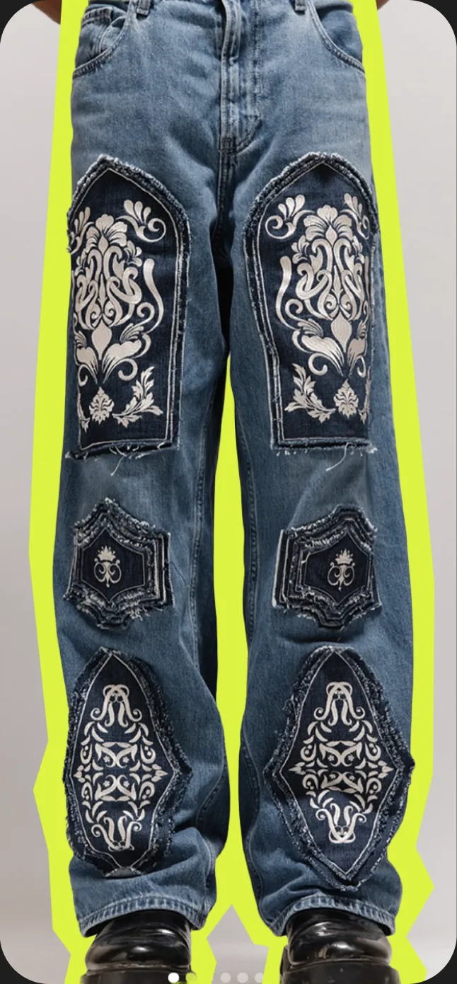 Wide-leg jeans with embroidered paisley patches on a lime outline.