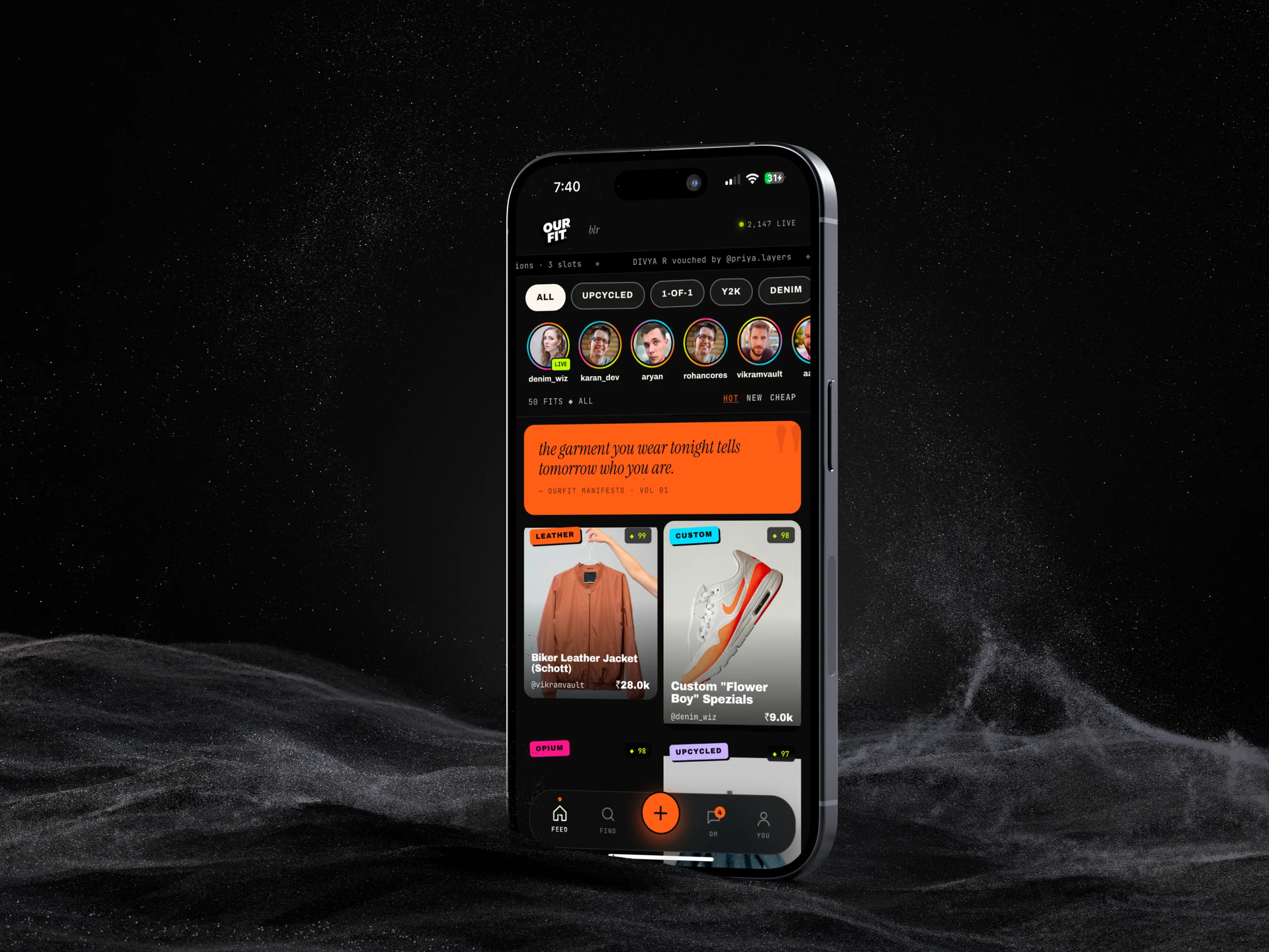 The ourFIT feed on an iPhone 15, standing on black sand.