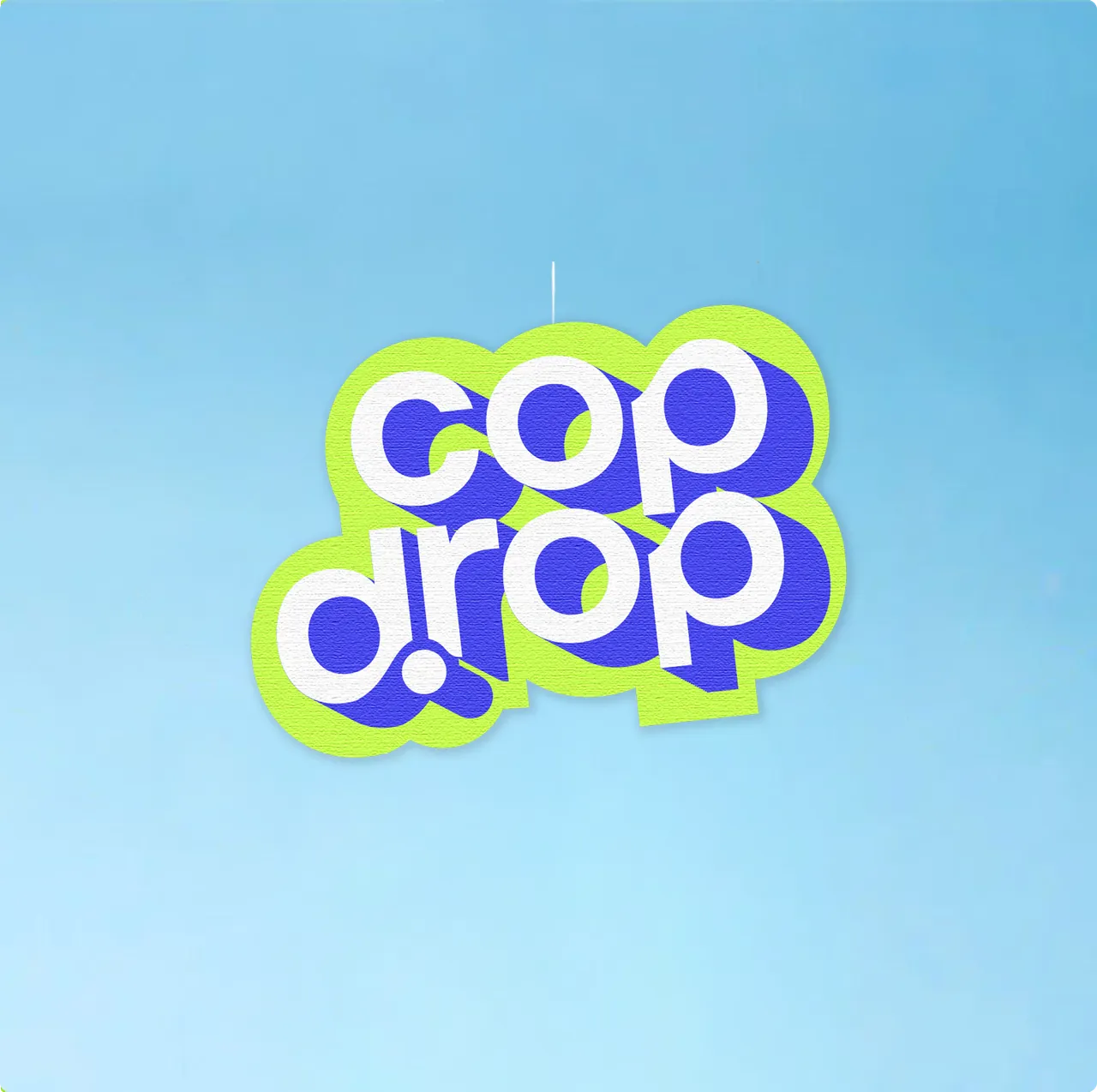 The cop drop sticker hanging against a blue sky